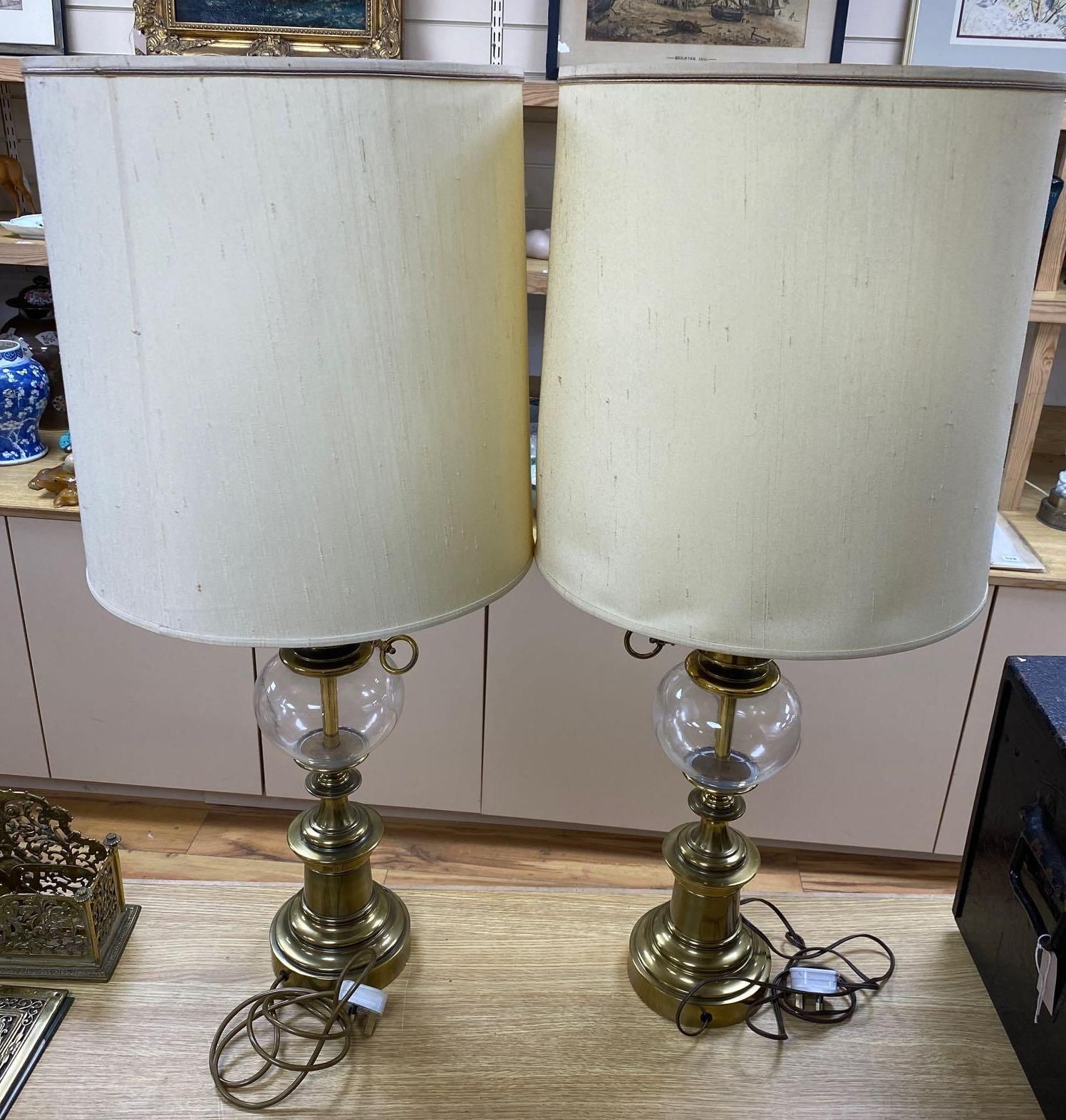 A pair of Art Nouveau style brass lamps, total height 67cm